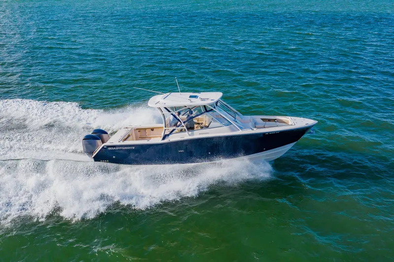  Yacht Photos Pics 2013 Grady-White Freedom 335 boat cruising on open water.