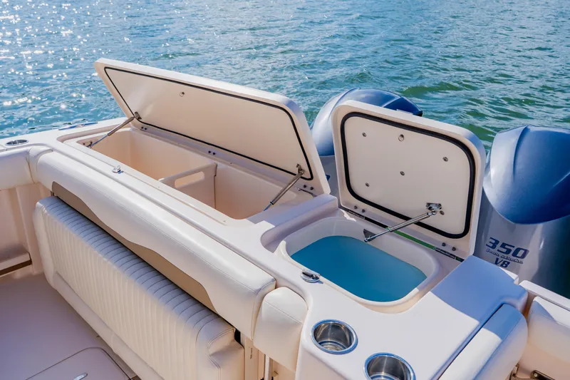  Yacht Photos Pics 2013 Grady-White Freedom 335 boat with open storage compartments and twin 350 V8 engines.