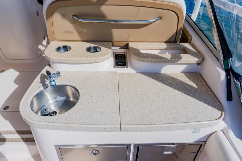  Yacht Photos Pics 2013 Grady-White Freedom 335 boat kitchenette with sink and countertop.
