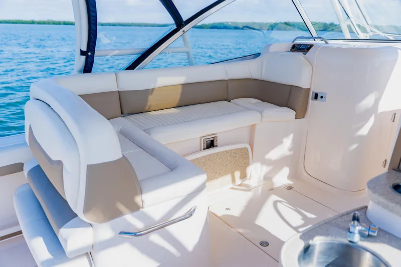  Yacht Photos Pics 2013 Grady-White Freedom 335 boat interior with cushioned seating and ocean view.