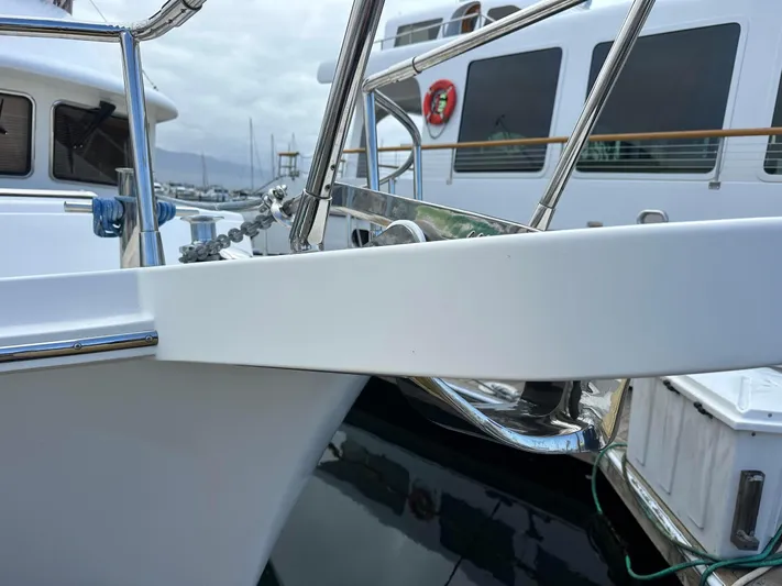  Yacht Photos Pics 2014 Selene EUROPA TRAWLER yacht bow with anchor and railing in marina.