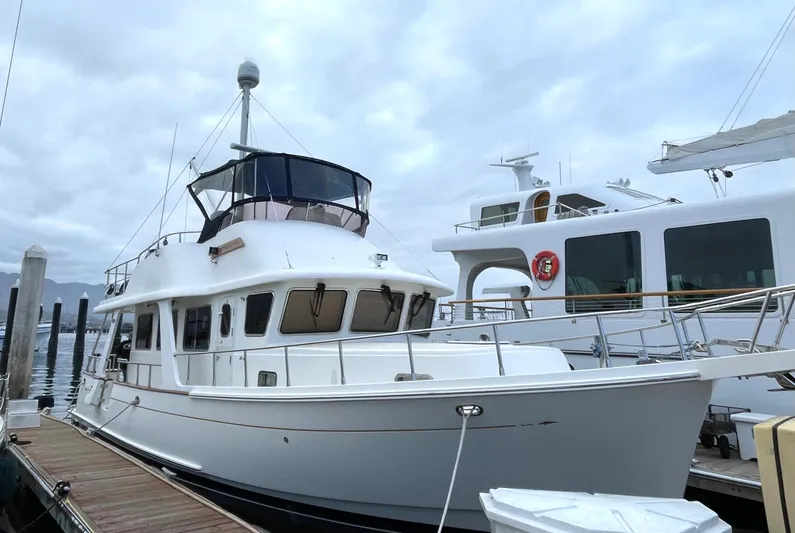  Yacht Photos Pics 2014 Selene EUROPA TRAWLER docked at marina under cloudy sky.