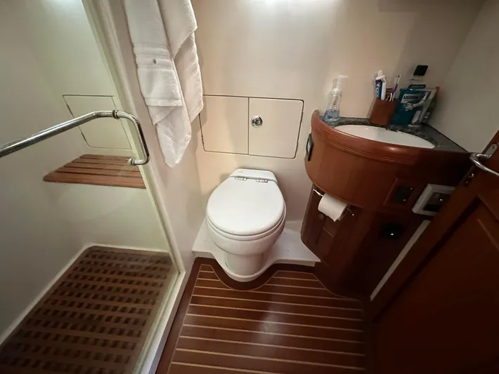  Yacht Photos Pics Bathroom interior of 2014 Selene EUROPA TRAWLER with wooden flooring and modern fixtures.