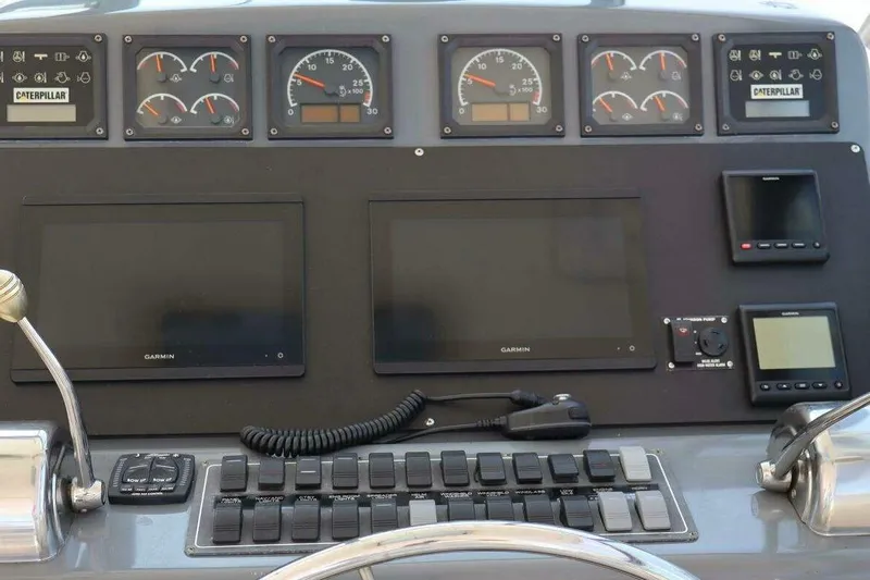  Yacht Photos Pics Dashboard of 2001 Tiara Yachts 4300 Open with Garmin displays and Caterpillar gauges.