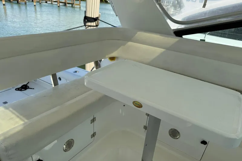  Yacht Photos Pics 2001 Tiara Yachts 4300 Open interior with seating and table, dockside view.