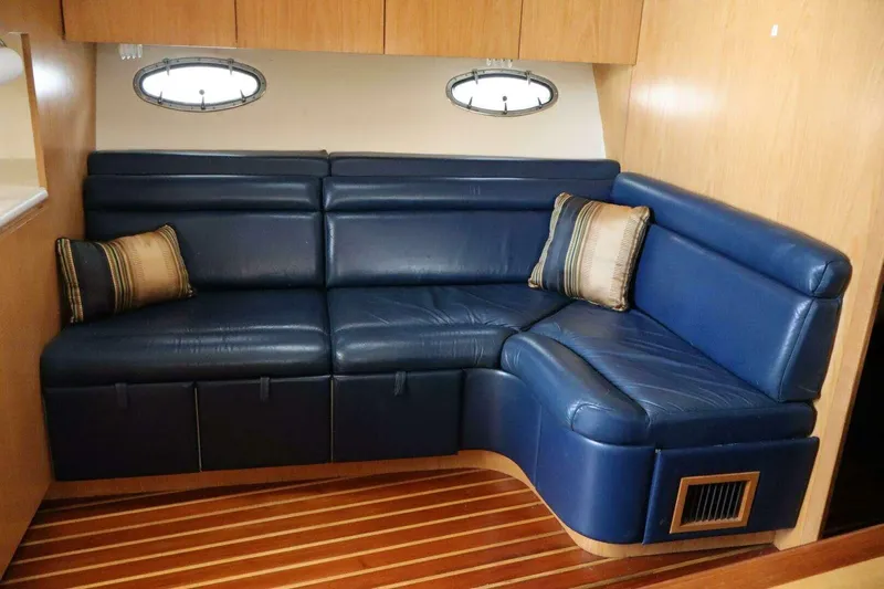  Yacht Photos Pics Luxurious blue leather seating in 2001 Tiara Yachts 4300 Open interior.