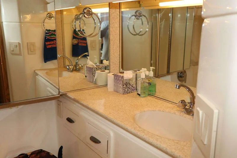  Yacht Photos Pics Bathroom vanity with mirror and sink on 2001 Tiara Yachts 4300 Open.