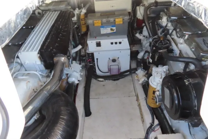  Yacht Photos Pics Engine room of 2001 Tiara Yachts 4300 Open, showcasing mechanical components and systems.