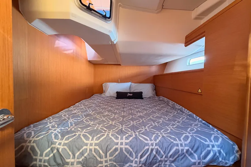 Joie Yacht Photos Pics Cozy cabin interior of 2011 Jeanneau 53 sailboat with comfortable bedding.