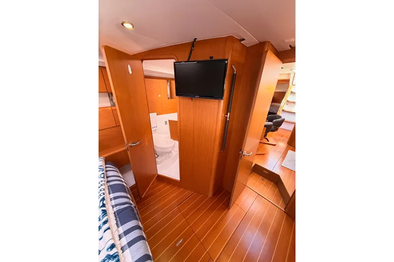 Joie Yacht Photos Pics Interior of 2011 Jeanneau 53 yacht with wood finish and modern amenities.