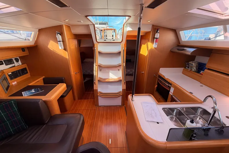 Joie Yacht Photos Pics Interior of 2011 Jeanneau 53 yacht with modern kitchen and seating area.