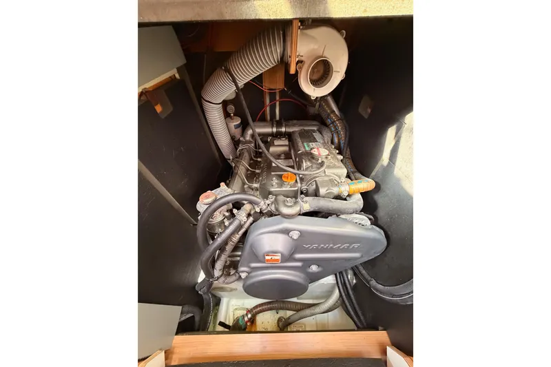 Joie Yacht Photos Pics Engine compartment of a 2011 Jeanneau 53 sailboat, featuring a Yanmar engine.
