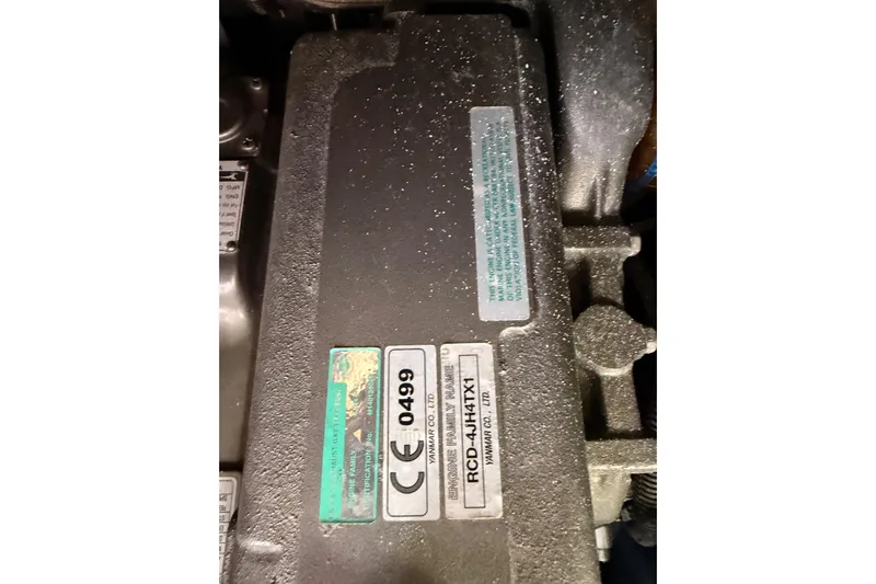 Joie Yacht Photos Pics Engine compartment of a 2011 Jeanneau 53 sailboat, featuring Yanmar engine details.