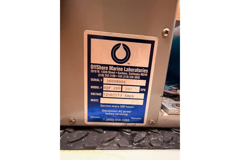Joie Yacht Photos Pics Label on marine equipment from Offshore Marine Laboratories, model SQF 200, 12VDC/15 Amps.