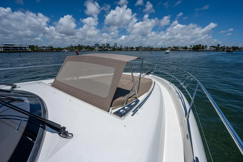  Yacht Photos Pics Prestige 550 yacht cruising on a sunny day, 2014 model, with clear blue skies.