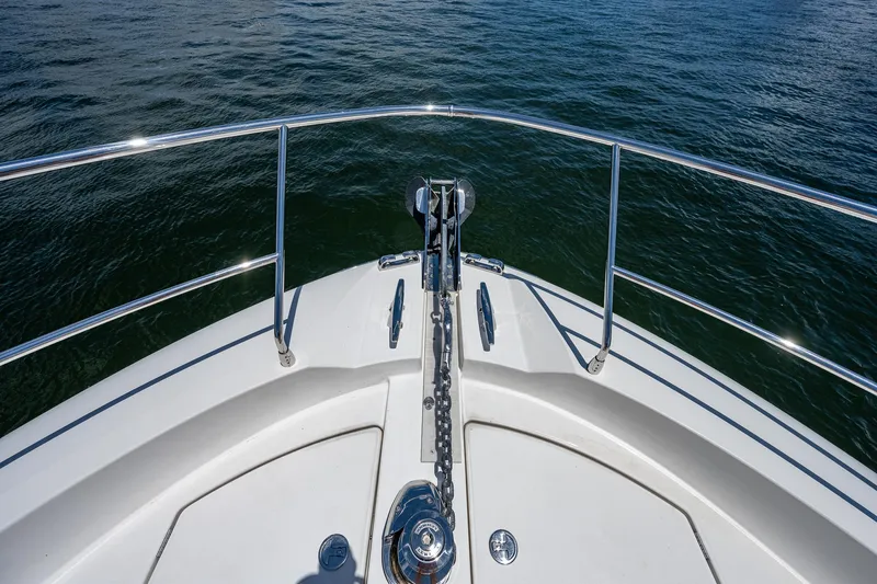  Yacht Photos Pics Bow of 2014 Prestige 550 yacht on calm water.