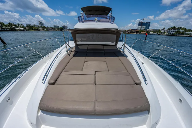  Yacht Photos Pics 2014 Prestige 550 yacht with spacious sun deck on calm waters.