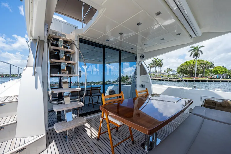  Yacht Photos Pics Luxurious 2014 Prestige 550 yacht interior with dining area and scenic water view.