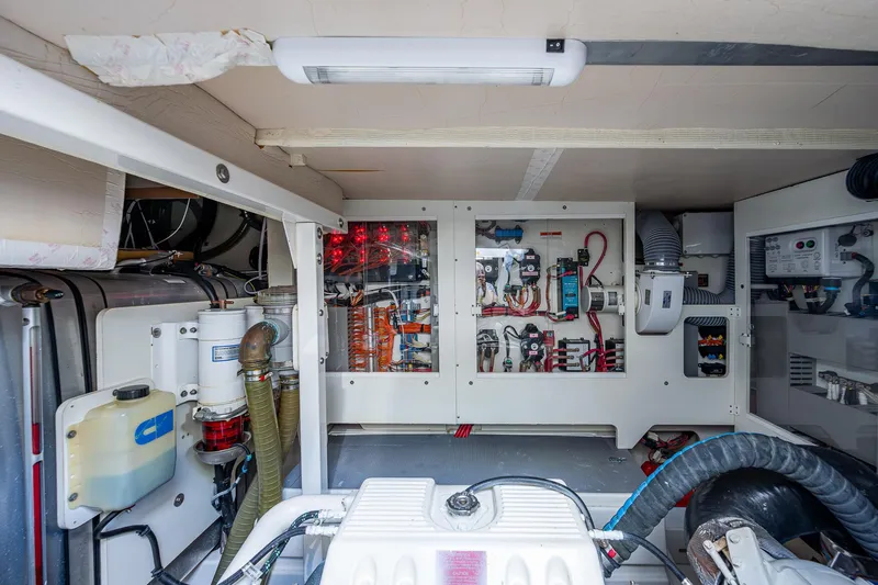  Yacht Photos Pics Engine room of 2014 Prestige 550 yacht, showcasing electrical systems and components.