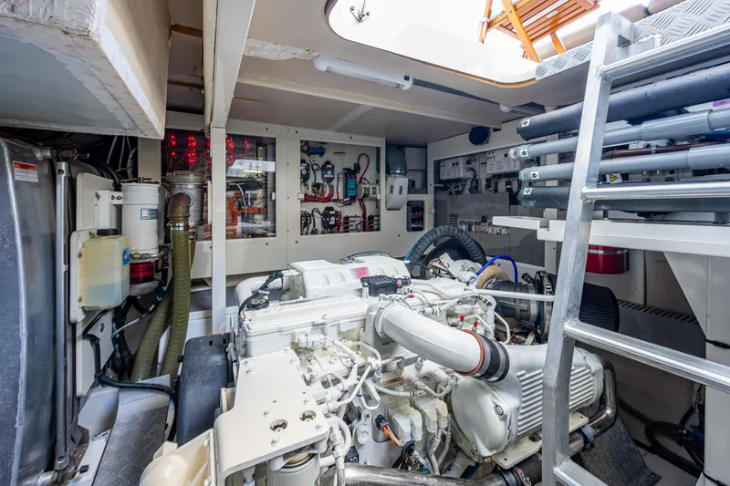  Yacht Photos Pics Engine room of a 2014 Prestige 550 yacht, showcasing mechanical components and equipment.
