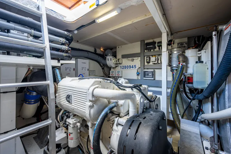  Yacht Photos Pics Engine room of 2014 Prestige 550 yacht with visible machinery and equipment.