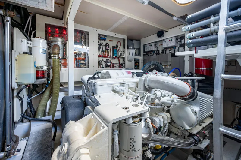  Yacht Photos Pics Engine room of 2014 Prestige 550 yacht with visible machinery and equipment.