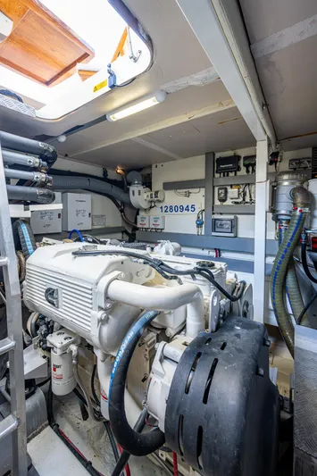  Yacht Photos Pics Engine room of 2014 Prestige 550 yacht with visible machinery and equipment.