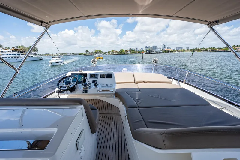  Yacht Photos Pics 2014 Prestige 550 yacht interior with helm, overlooking scenic waterfront.