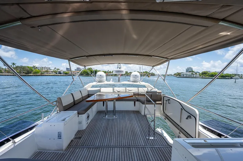  Yacht Photos Pics Spacious deck of 2014 Prestige 550 yacht with seating and scenic water view.