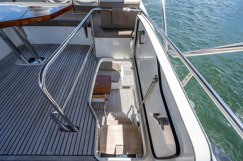  Yacht Photos Pics Prestige 550 yacht deck with stairs, 2014 model, overlooking water.