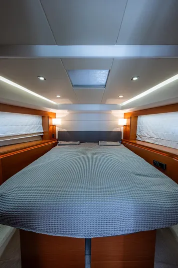  Yacht Photos Pics Luxurious bedroom interior of 2014 Prestige 550 yacht with modern lighting.