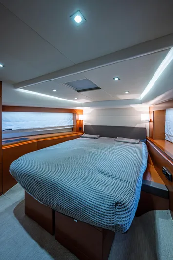  Yacht Photos Pics Luxurious bedroom interior of 2014 Prestige 550 yacht with modern lighting.