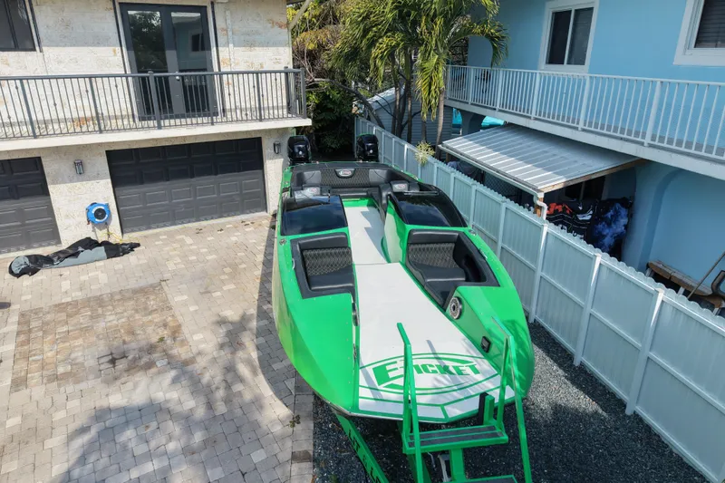  Yacht Photos Pics Green 2021 E-Ticket 29 boat parked in a residential driveway.