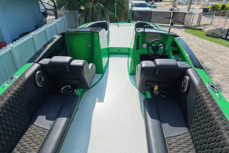  Yacht Photos Pics Interior of 2021 E-Ticket 29 boat with green accents and black seating.