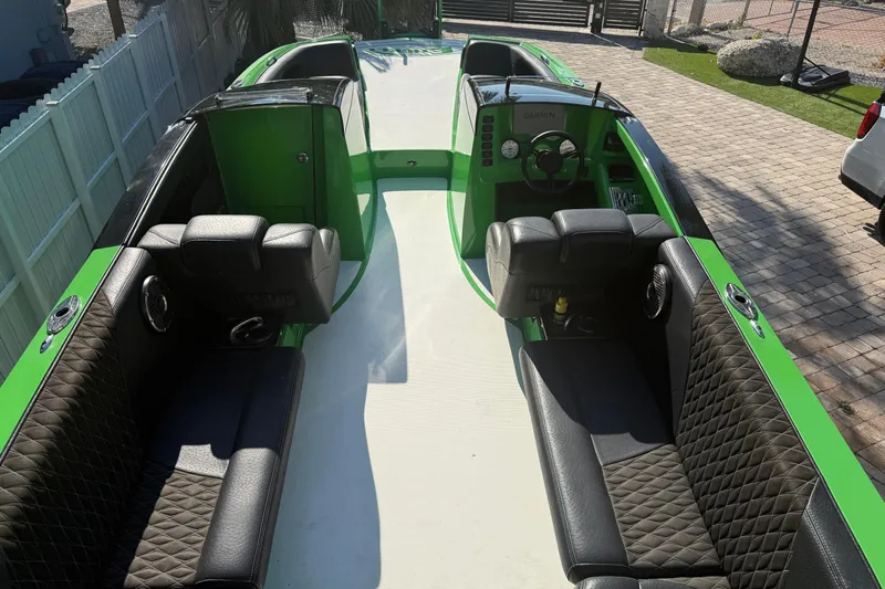  Yacht Photos Pics 2021 E-Ticket 29 boat with green accents and black quilted seating.