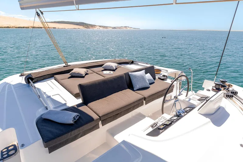  Yacht Photos Pics Luxurious 2021 Lagoon 46 catamaran with spacious deck and scenic ocean view.