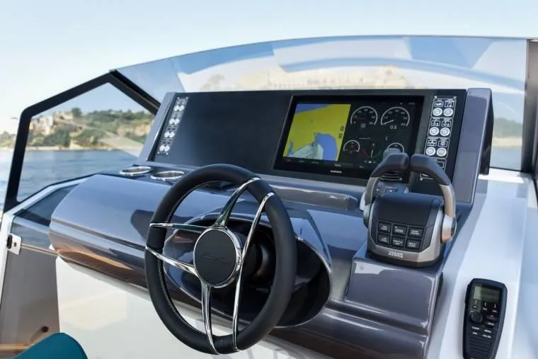  Yacht Photos Pics 2024 Fiart Seawalker 39 dashboard with modern steering and navigation display.