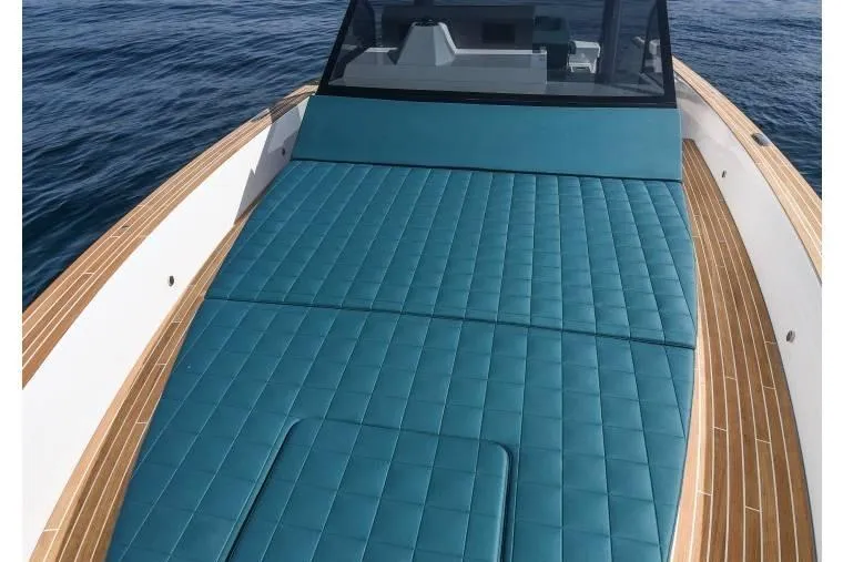  Yacht Photos Pics 2024 Fiart Seawalker 39 boat with teal deck and sleek design on open water.