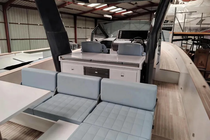  Yacht Photos Pics 2024 Fiart Seawalker 39 yacht interior with modern seating and helm station.