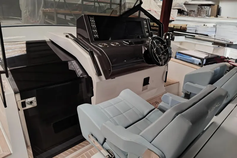  Yacht Photos Pics 2024 Fiart Seawalker 39 helm with modern controls and comfortable seating.