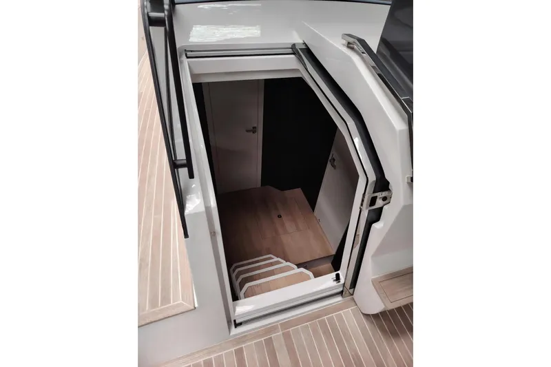  Yacht Photos Pics 2024 Fiart Seawalker 39 yacht interior stairs with open hatch, showcasing modern design.