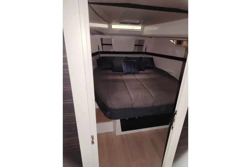  Yacht Photos Pics 2024 Fiart Seawalker 39 cabin interior with cozy bed and modern design.