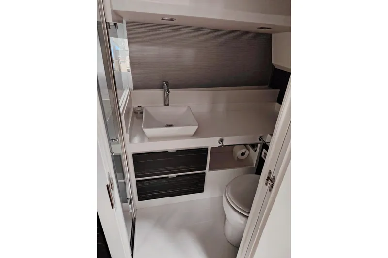  Yacht Photos Pics 2024 Fiart Seawalker 39 bathroom with modern sink, toilet, and storage.