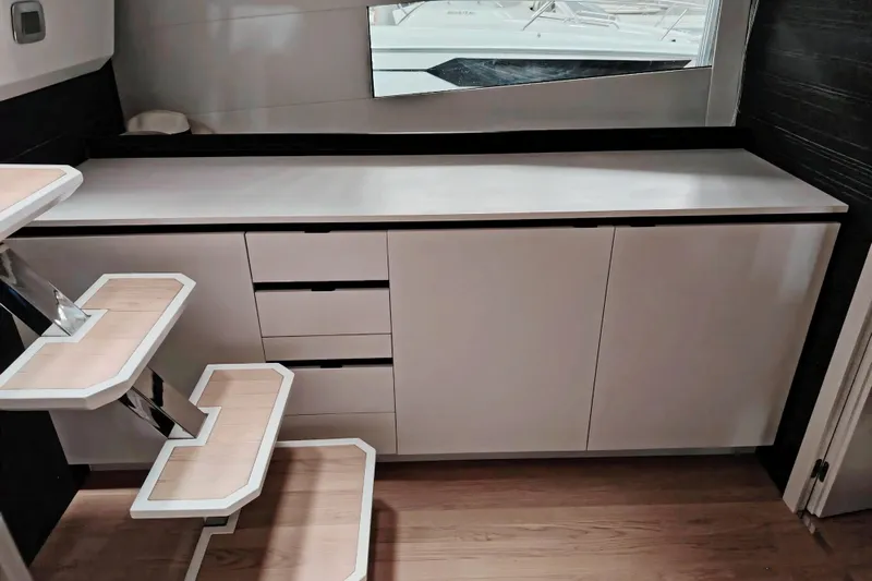  Yacht Photos Pics 2024 Fiart Seawalker 39 interior with modern cabinetry and sleek wooden steps.