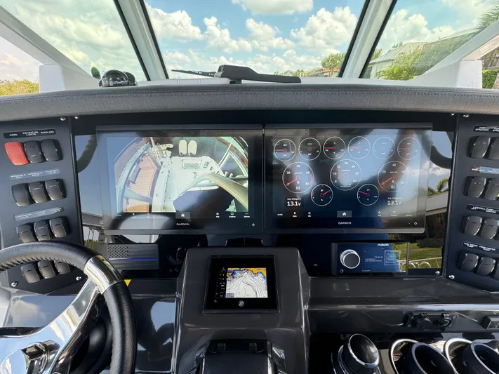  Yacht Photos Pics 2024 Blackfin 332 CC helm with advanced navigation and control displays.