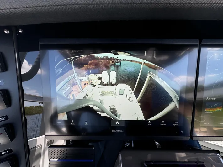  Yacht Photos Pics 2024 Blackfin 332 CC boat with Garmin display showing rear view camera on water.