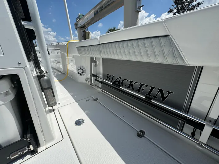  Yacht Photos Pics 2024 Blackfin 332 CC boat deck with sleek design and modern features under a sunny sky.