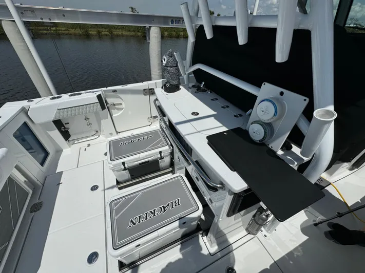  Yacht Photos Pics 2024 Blackfin 332 CC boat interior with seating and fishing equipment.