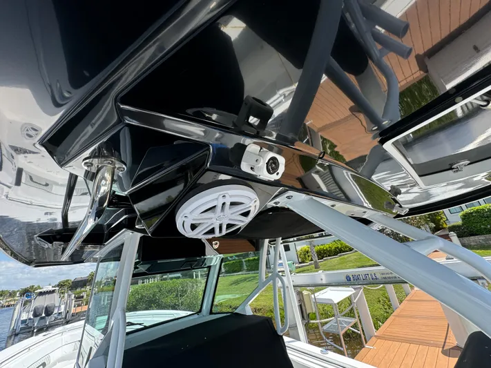  Yacht Photos Pics 2024 Blackfin 332 CC boat with sleek design and modern features, docked by the water.