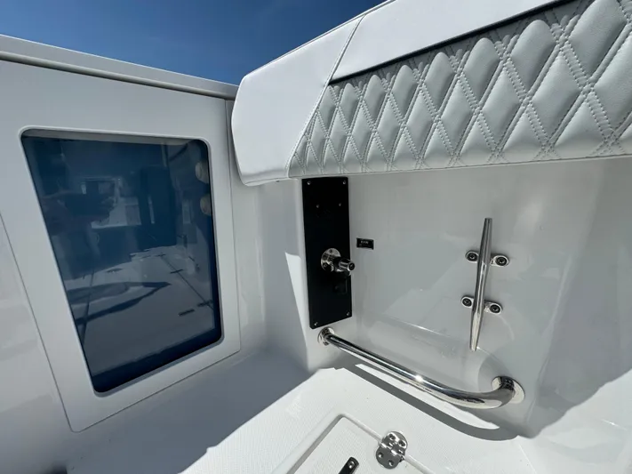  Yacht Photos Pics 2024 Blackfin 332 CC boat interior with quilted upholstery and stainless steel fixtures.